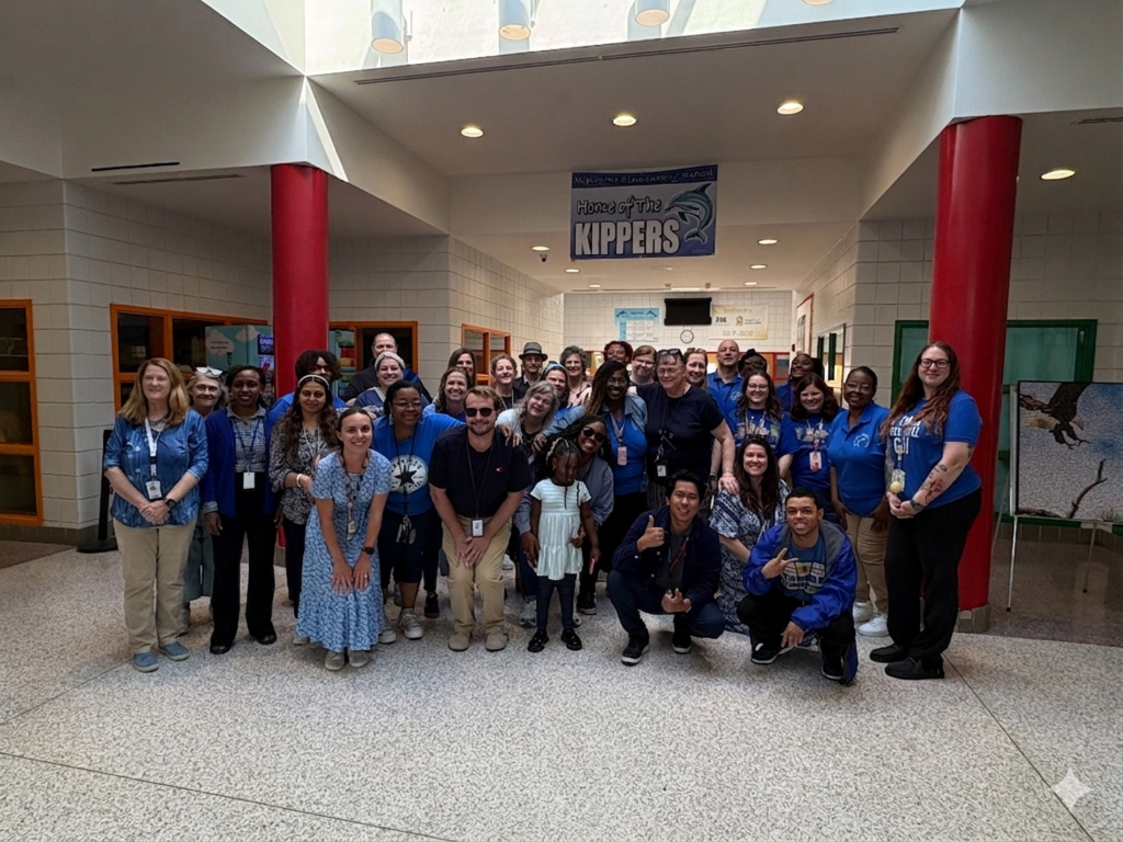 KES staff group photo of them all wearing blue to support Autism Awareness Month