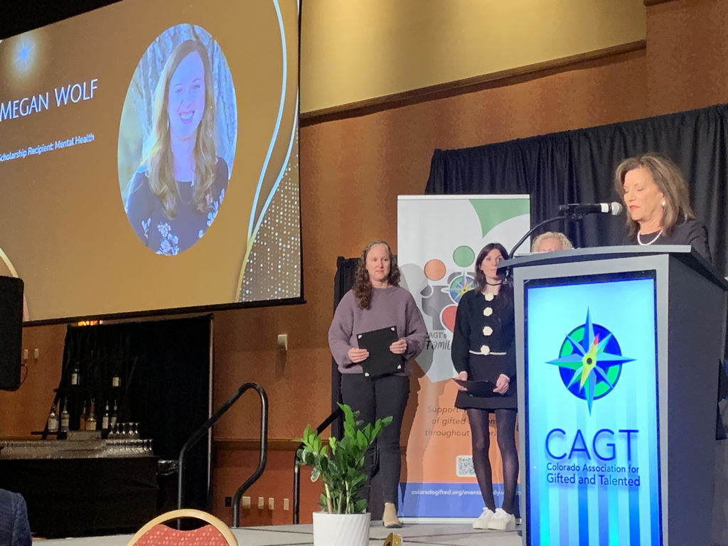 Megan Wolf, receiving scholarship