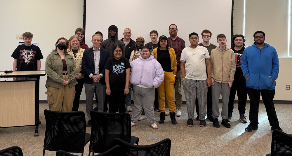 A group of students smiling at the camera with Secretary of State Steve Simon in the front row