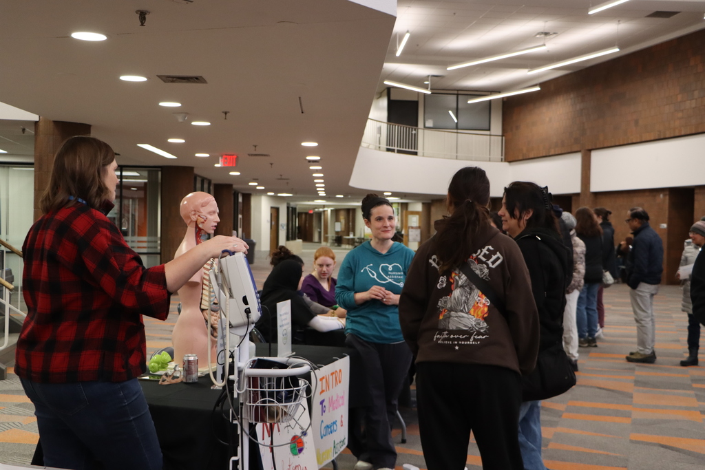 Staff engaging with student and family about program.