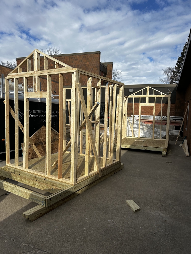 Image of a the starting structure of a sauna that is being built outside.
