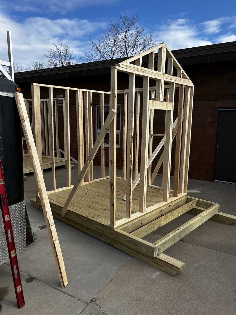 Image of a the starting structure of a sauna that is being built outside.
