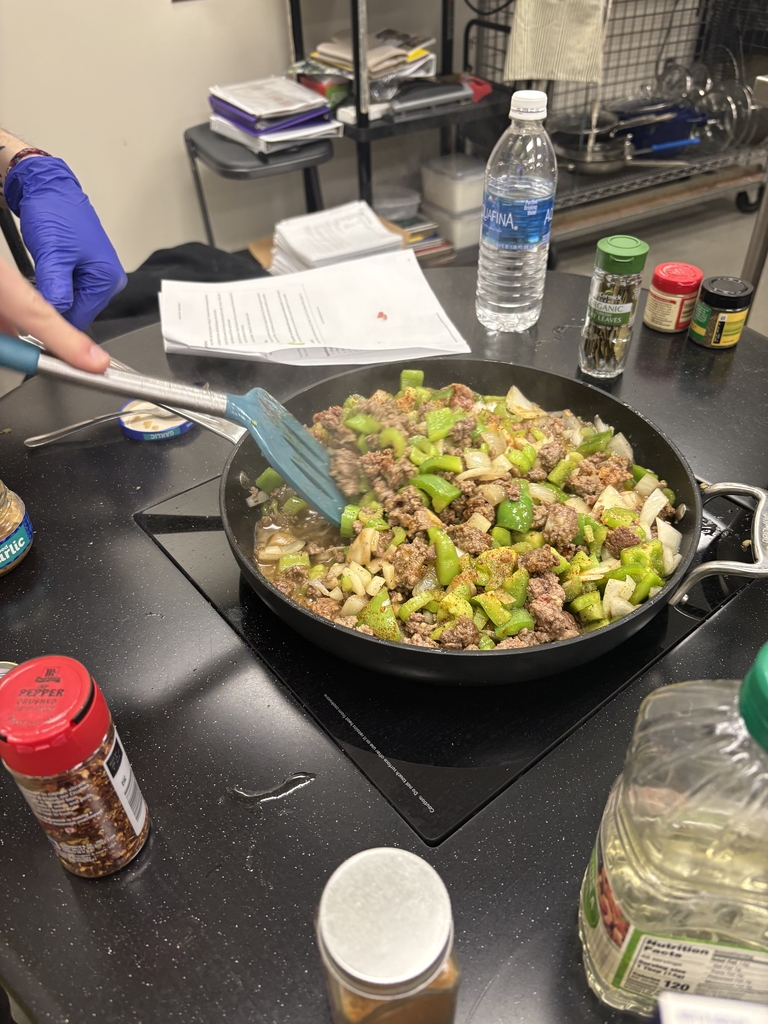 Image of food being cooked in a pan. 