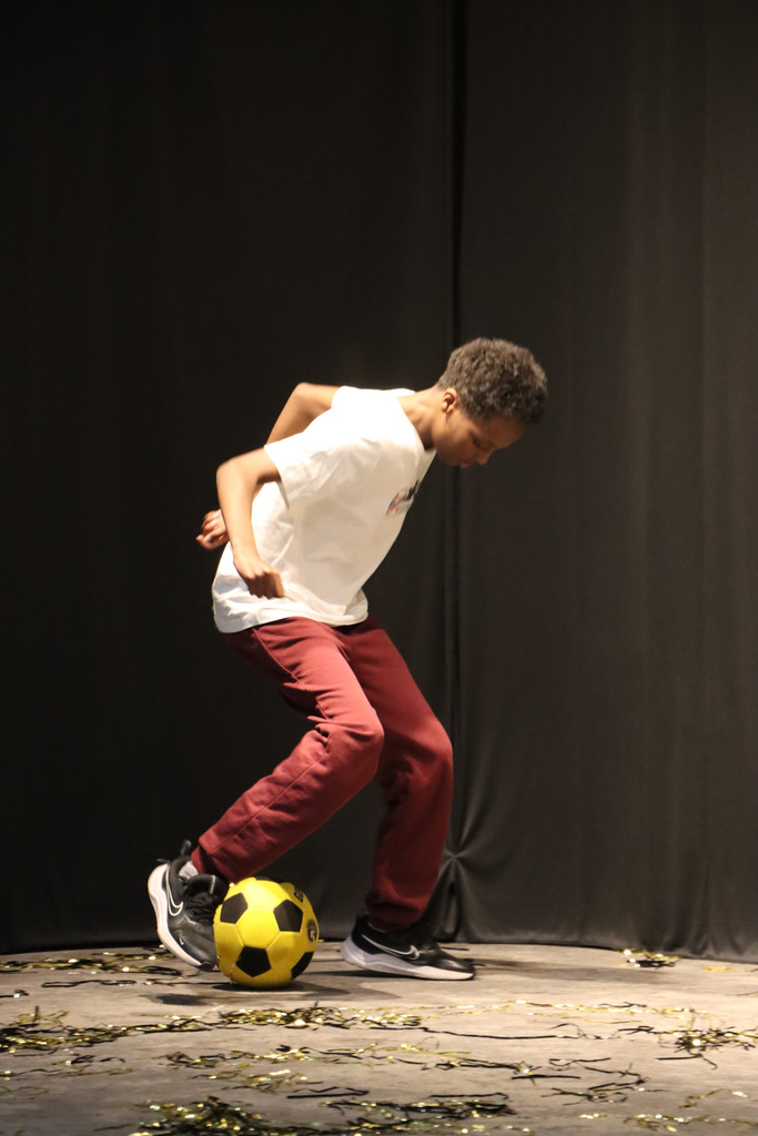 Student performing their soccer skills. 