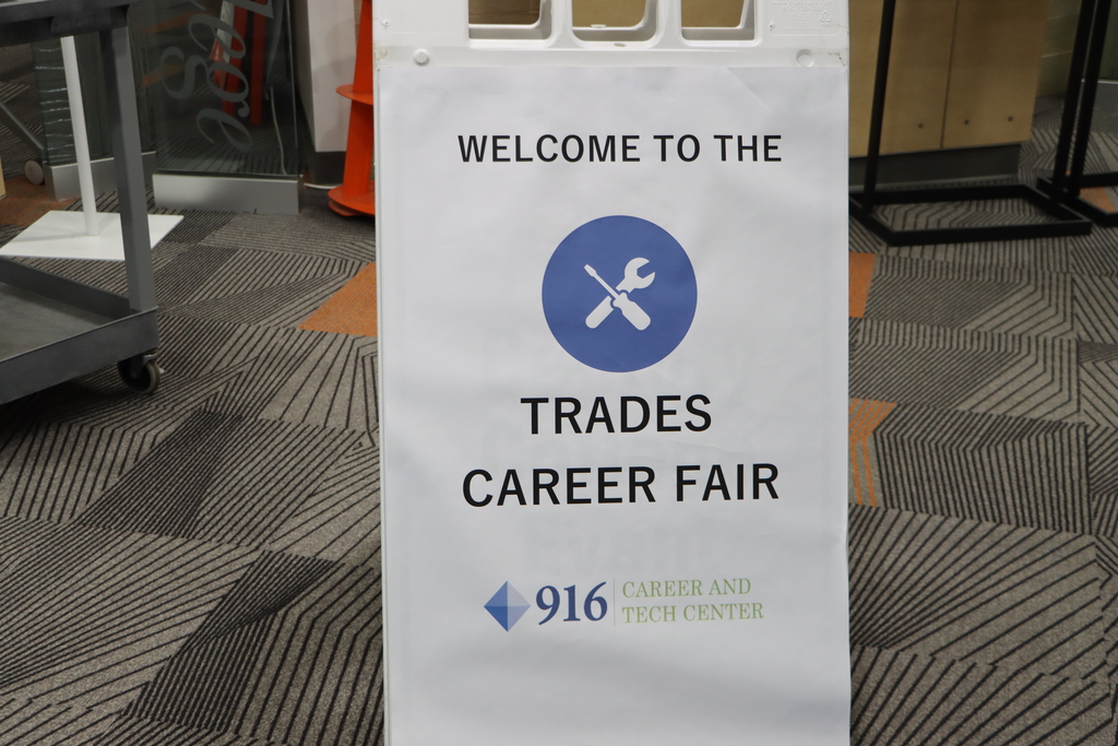 Sign that says, "Welcome to the Trades Career Fair" with a logo that has a screwdriver and wrench above it.