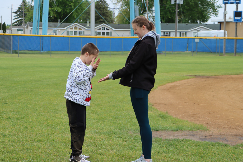 Student and staff clapping hands together. 
