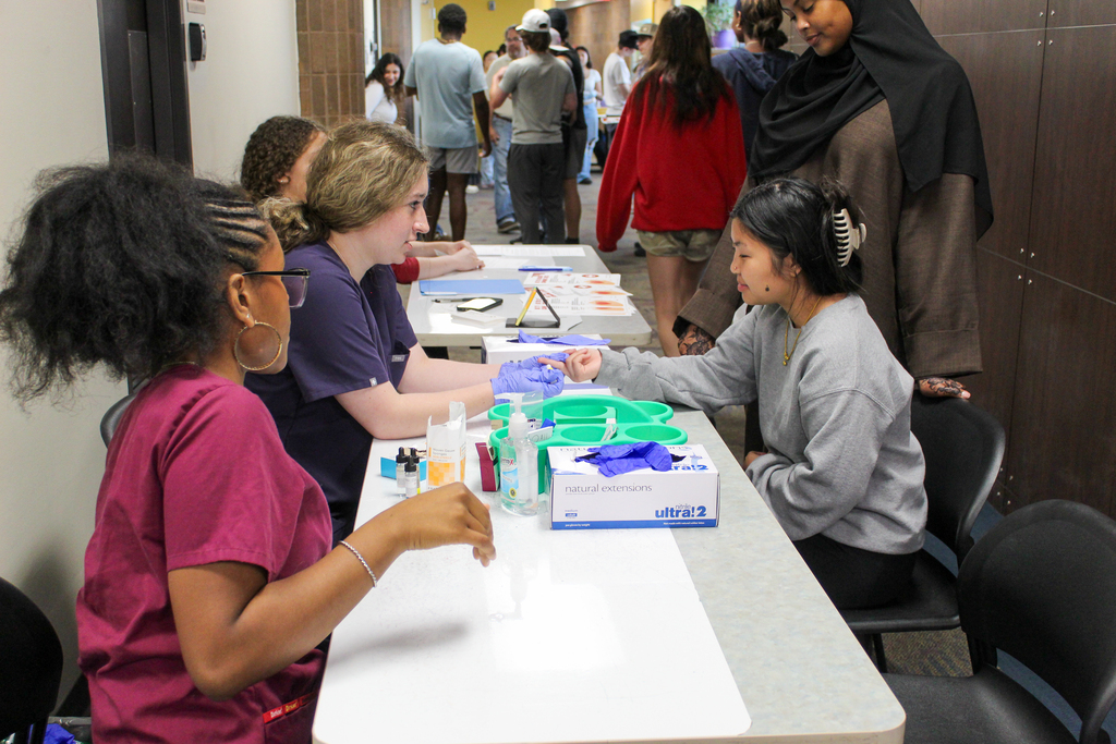 Students doing a blood typing test. 