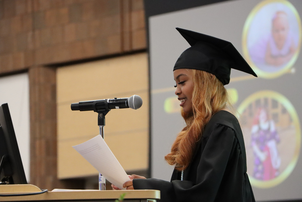 Student graduate giving a speech at graduation.