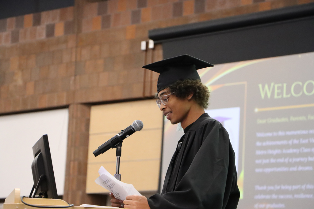 Student graduate giving a speech at graduation.