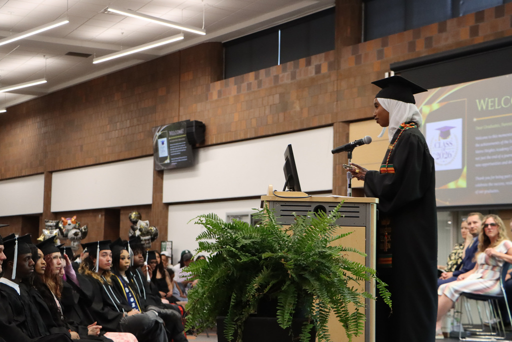 Student graduate giving a speech at graduation.