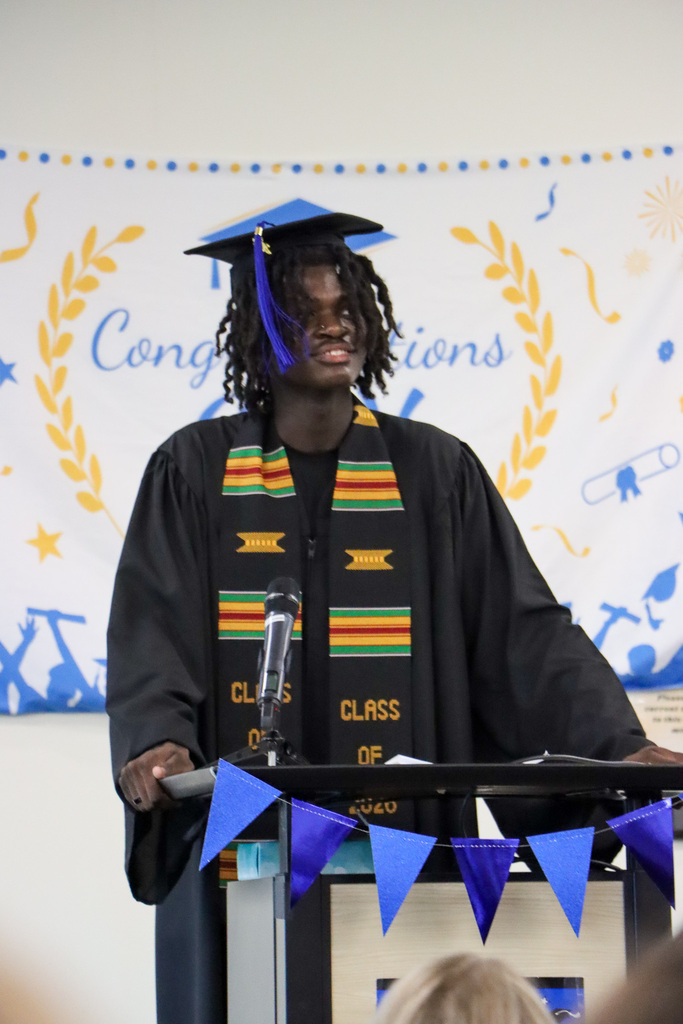 Student graduate giving a speech at graduation.