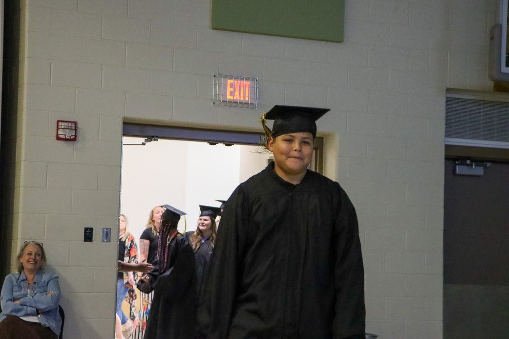 Student graduate walking into the graduation ceremony.