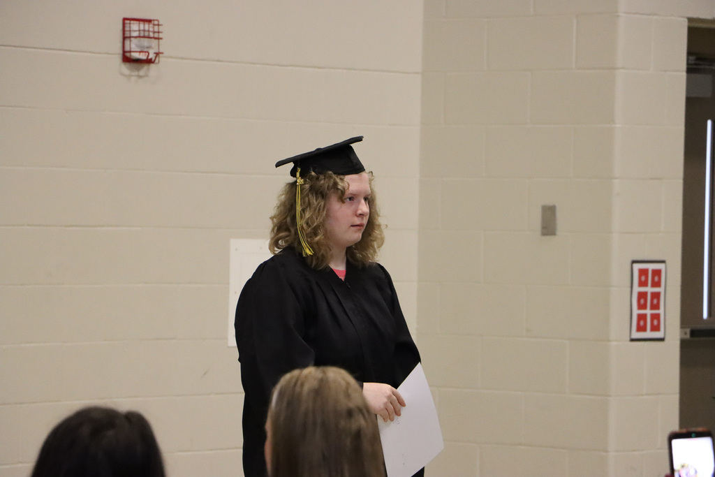 Student graduate with a certificate in their hands. 