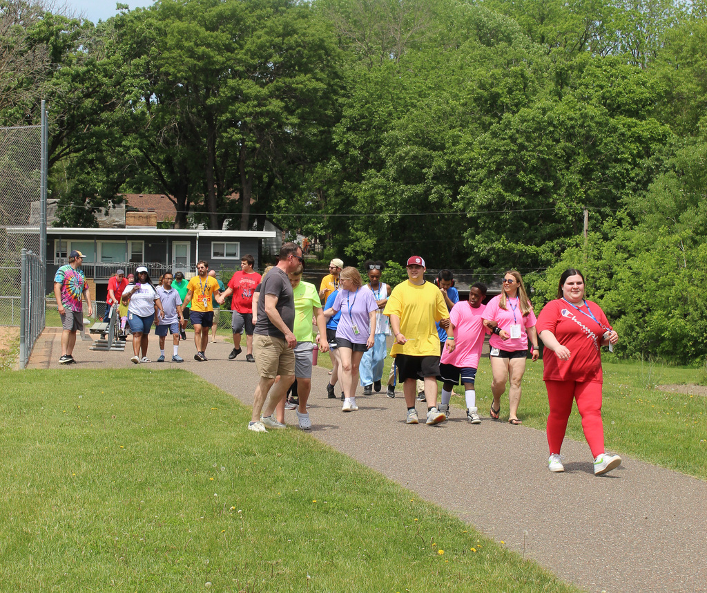 Students, staff, and families doing a victory lap around the track. 