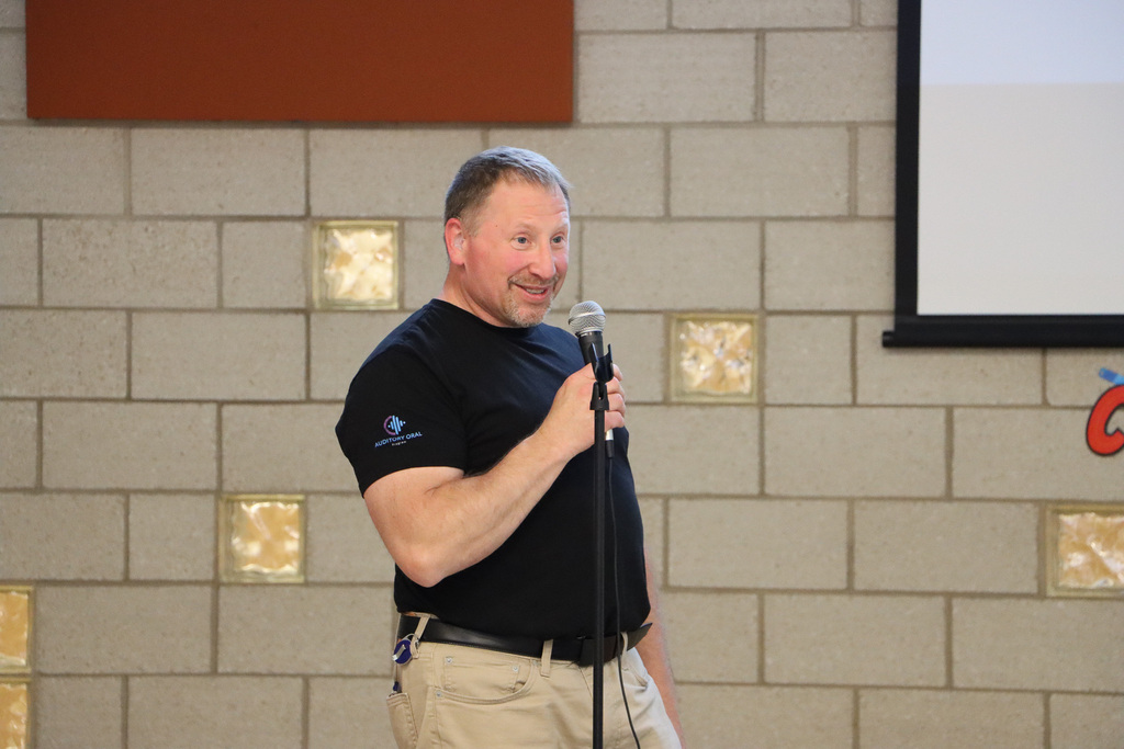 Principal giving a speech during ceremony.