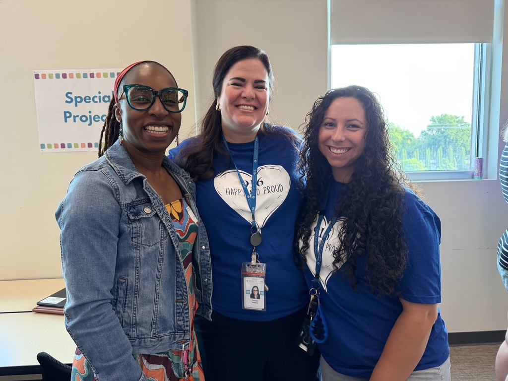 Three staff smiling for a picture. 