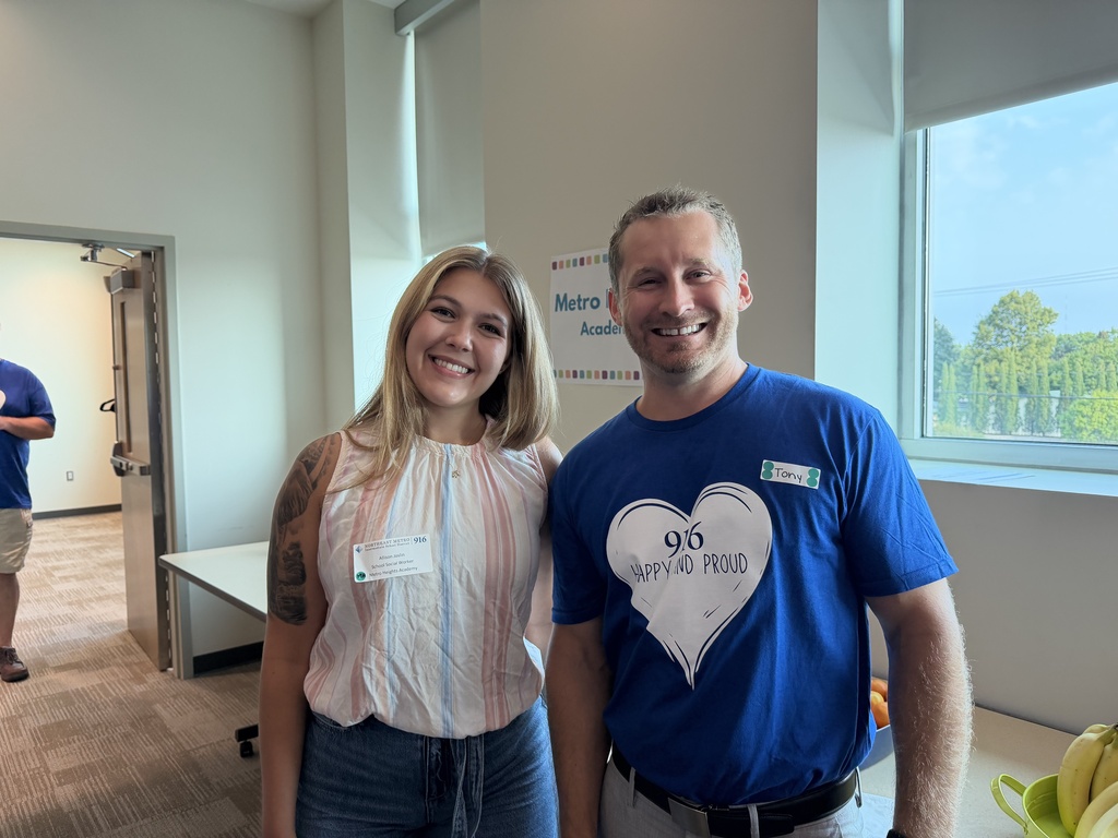 Two staff smiling for a picture.