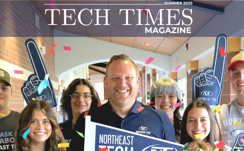 Superintendent Beller poses with students with celebration confetti and Northeast Tech memorabilia. 
