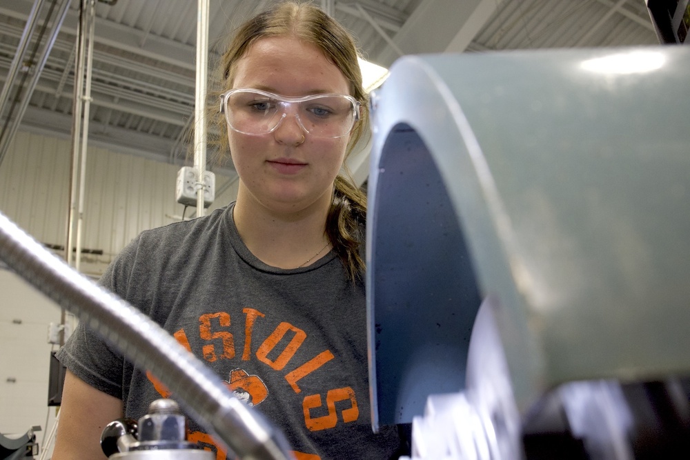 Jazmine Cookson is learning how to machine parts on a manual lathe in the CNC Machining shop at Northeast Tech Claremore.  PHOTO BRITTNEY ROGERS