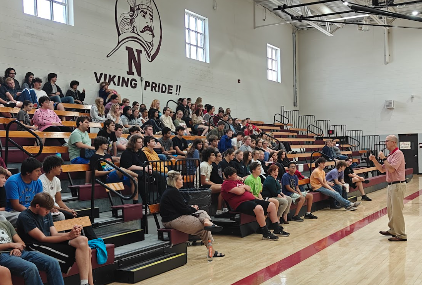 Dr. Streeter talking to high schoolers