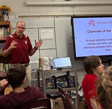Dr Streeter talking with Junior high students