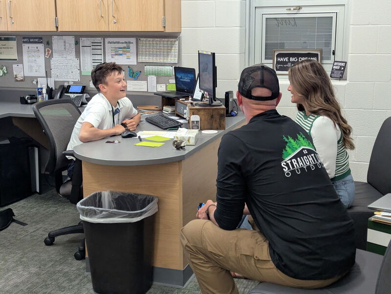 Kipton talking to his parents