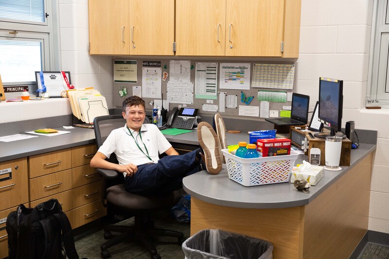 Kipton at the principal desk