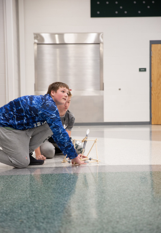 kids using a catapult