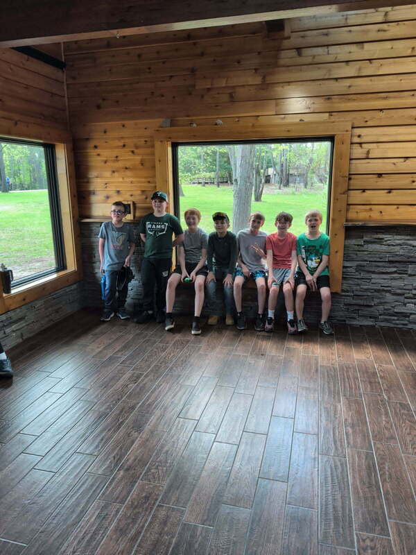 kids sitting in a cabin