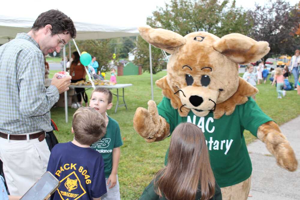 Bobby Bobcat greets families at the 2026 NAC Elementary Fall Festival