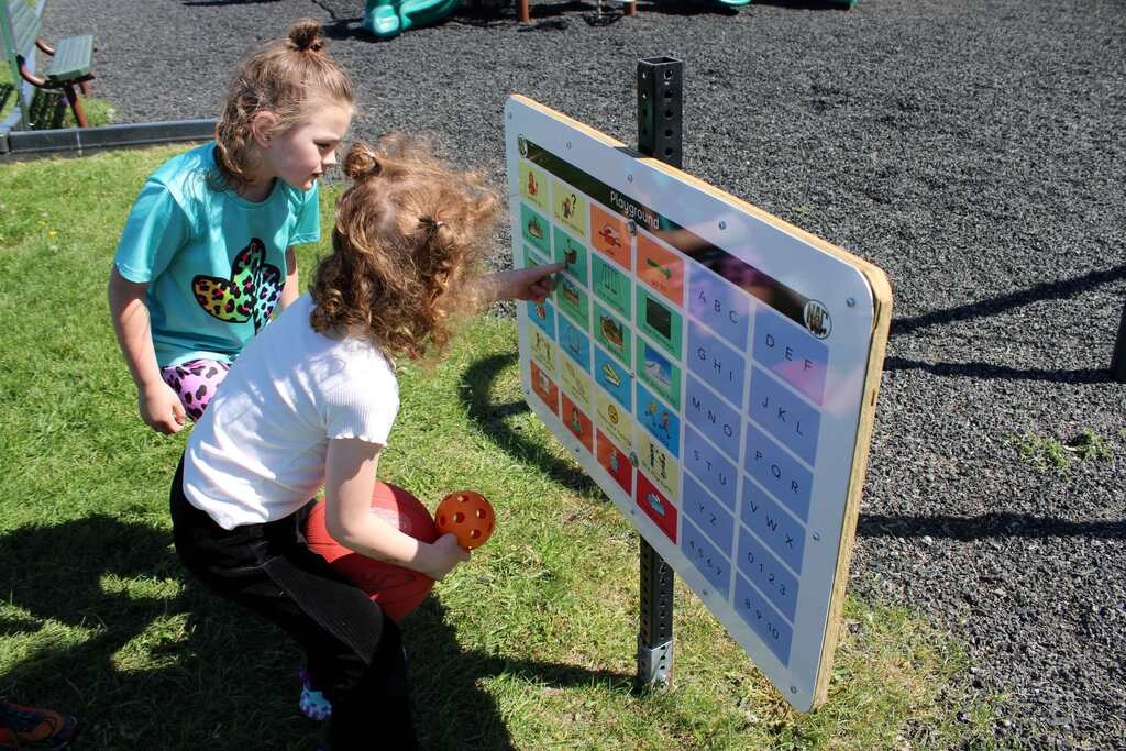 Students use outdoor communication board