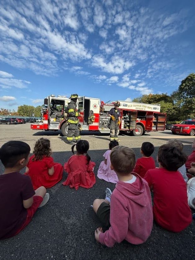 Tots listening to the firemen