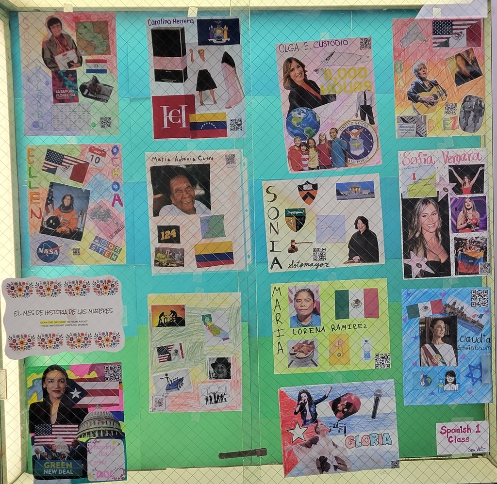 A bulletin board displays various photographs and collages, including images of people and flags.