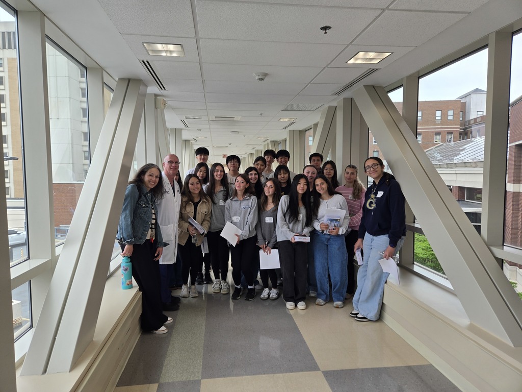 Biomed students with teacher at hospital.