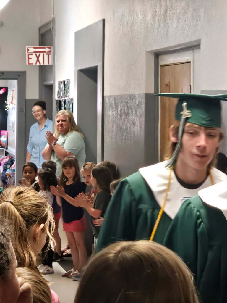 2026 Senior walk the halls of the grade school one last time.