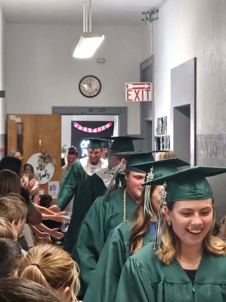 2026 Senior walk the halls of the grade school one last time.
