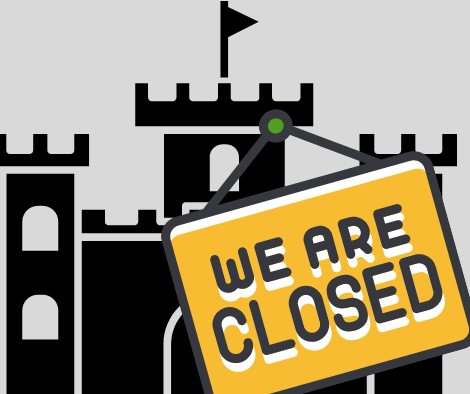 we are closed on a yellow sign hanging on a black castle