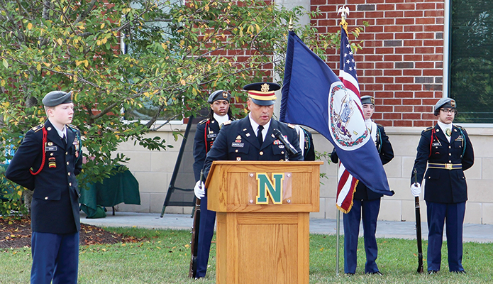 Maj. Francisco Gonzalez was joined by Cadet Ethan Dixon and the JROTC color guard during his remarks. Photo by Jackie Nunnery
