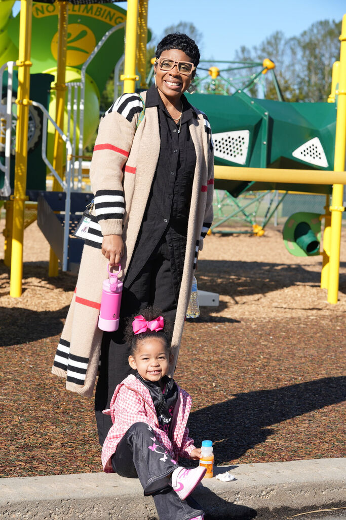 Momma with child at ribbon cutting