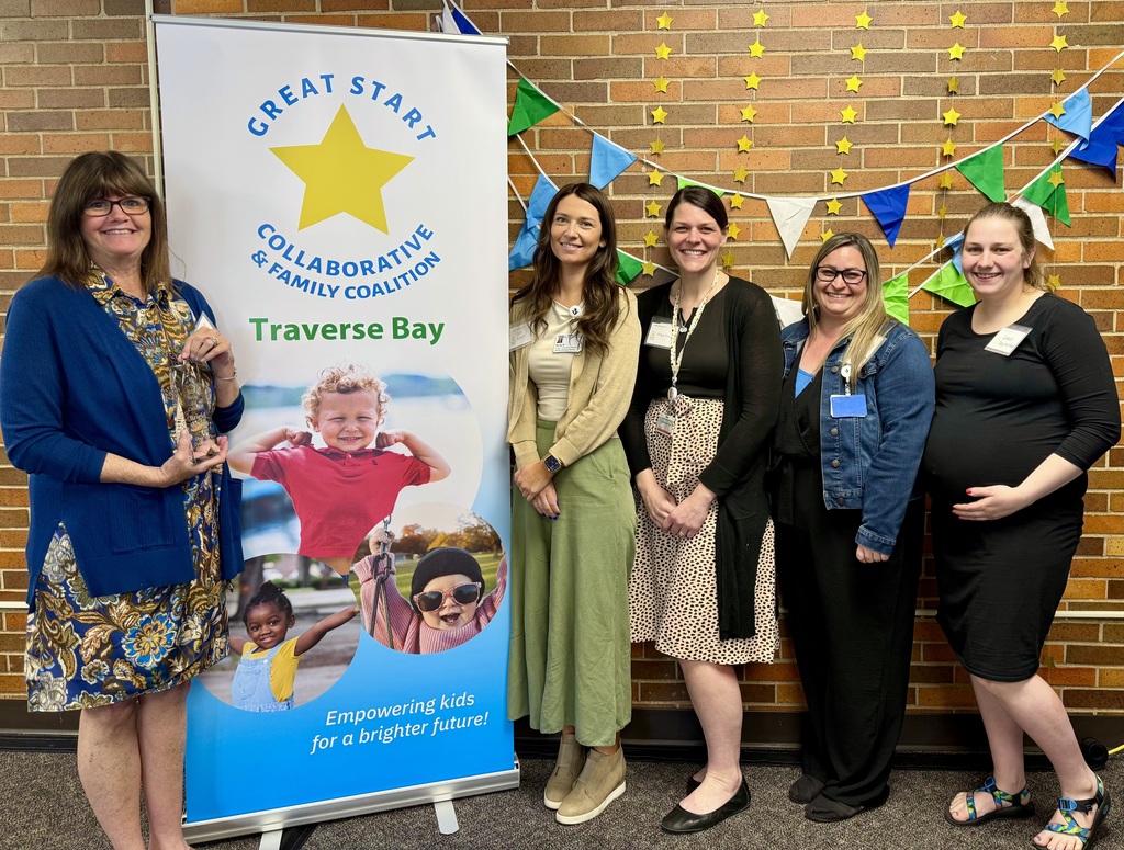 Congratulations to Brigid Wilson, recipient of the Voices for Children Award. Photo of Brigid  holding her award (Left) and some of her teammates (Right).