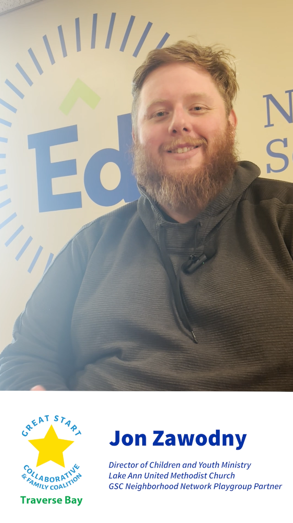 Thumbnail of a Youtube video featuring Jon Zawodney, Directory of Children and Youth Ministry Lake Ann United Methodist Church and GSC Neighborhood Network Playgroup Partner, sharing his Great Start Collaborative & Family Coalition Traverse Bay story. Jon is has short red hair, beard, and is wearing green hoody, smiling in front of a Northwest Education Services wall decal.