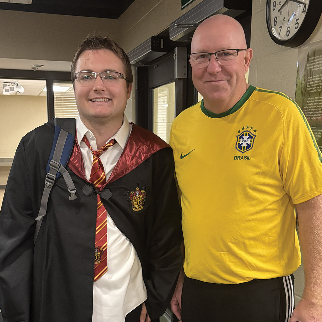 Mr. John dressed as a Brazilian soccer player with a Transition Campus student dressed as Harry Potter.