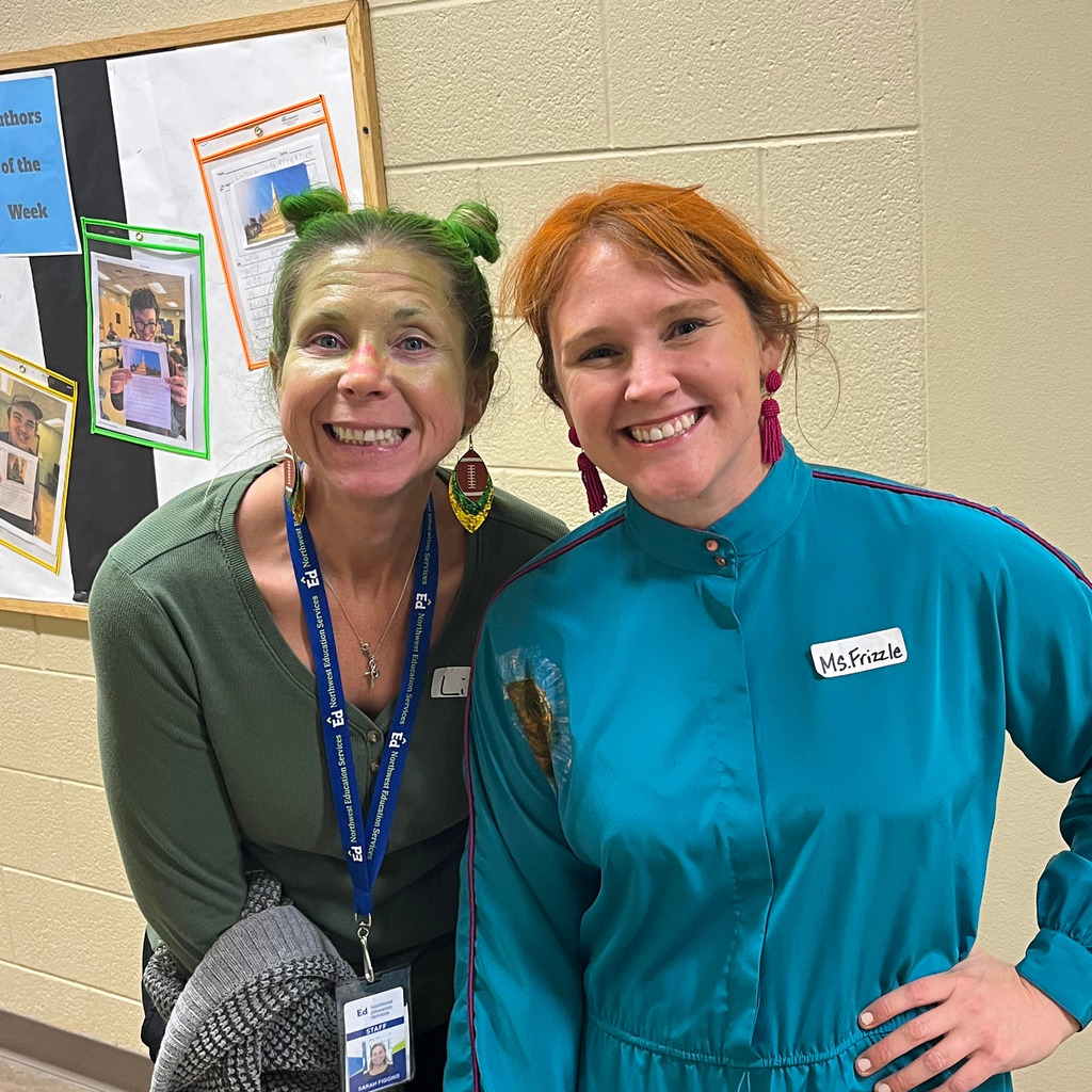 Two North Ed Transition Campus staff members dressed up as Ms. Frizzle from Magic School Bus and a football field.