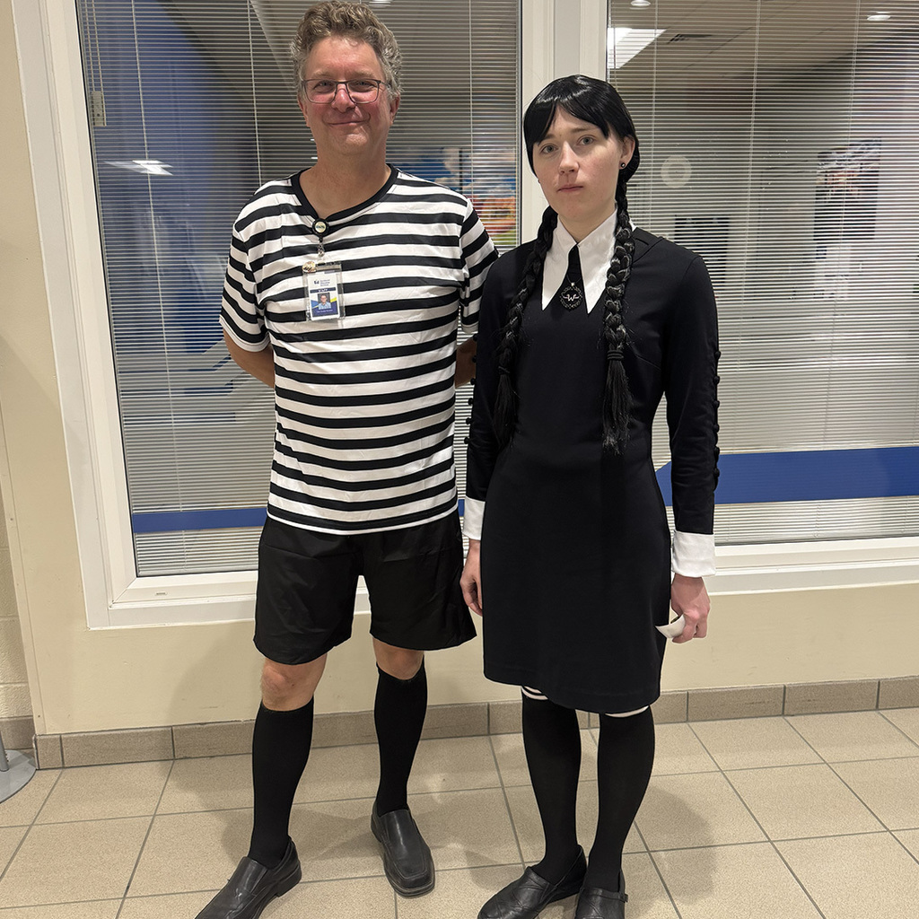 Robotics and Automation instructor and paraprofessional dressed as Pugsley and Wednesday Addams.