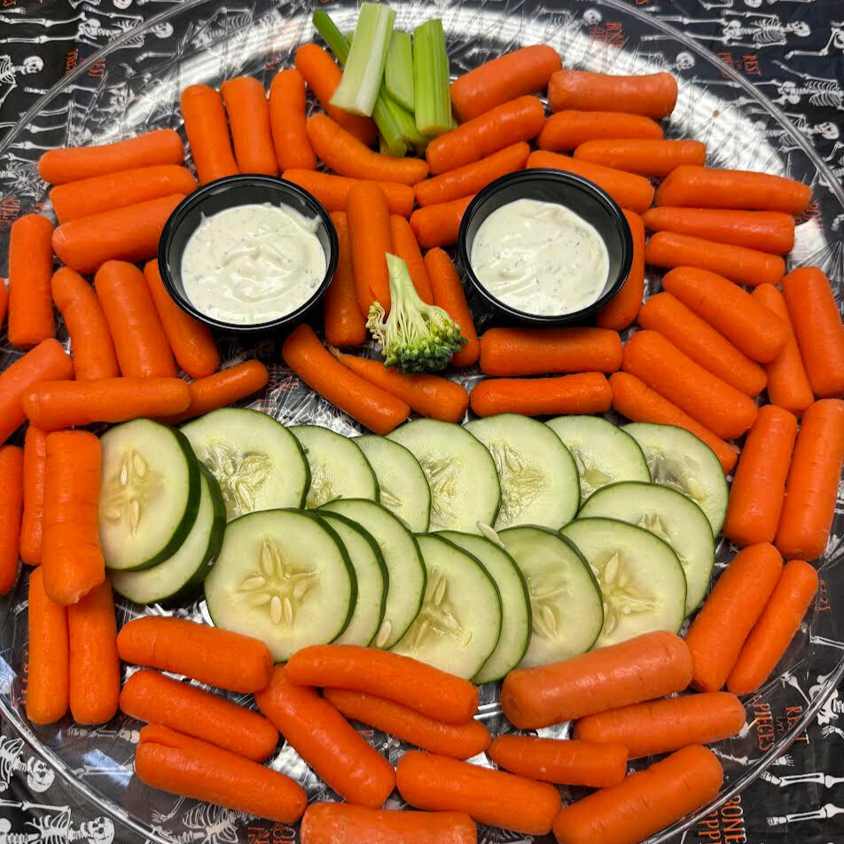 Platter of vegetables that looks like a jack-o-lantern, created by ACE Downtown students. 