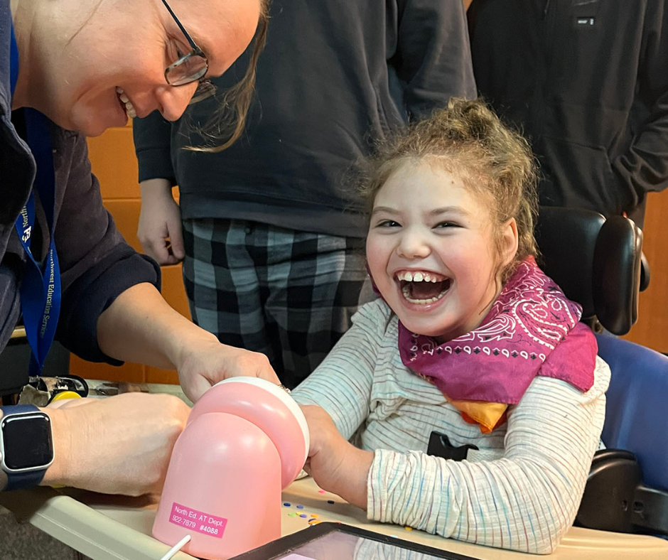 Career Tech and New Horizons students playing with adaptive toys. 