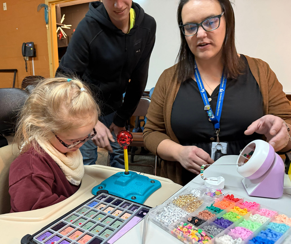 Career Tech and New Horizons students playing with adaptive toys. 