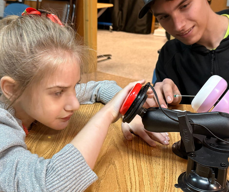 Career Tech and New Horizons students playing with adaptive toys. 