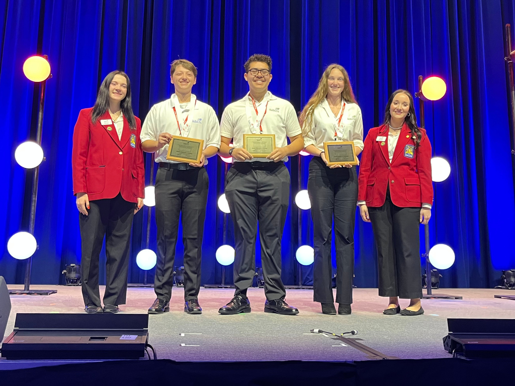 North Ed Career Tech Aviation Maintenance students posing on stage at 2026 SkillsUSA Michigan with their awards. 