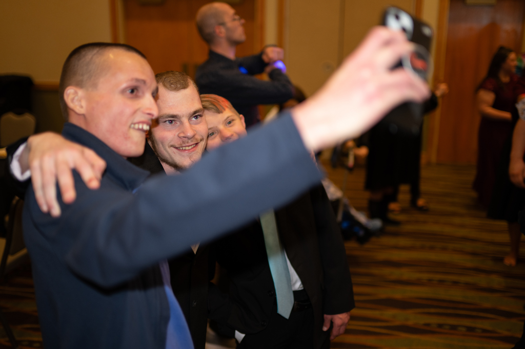 Three Transition Campus students posing for a selfie at prom.